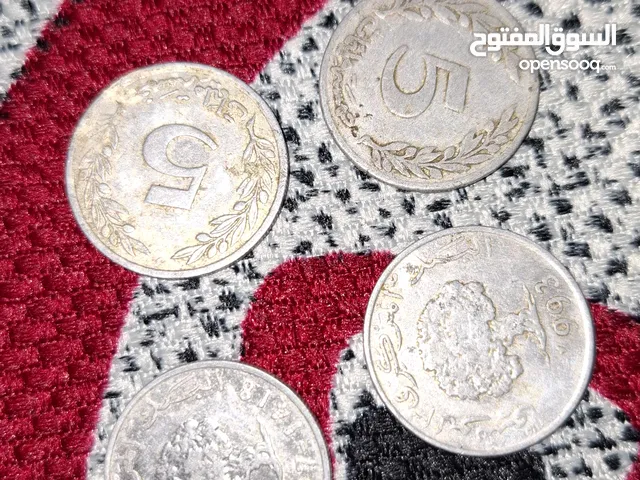 اربعة قطع نقدية ب 5 مليم
