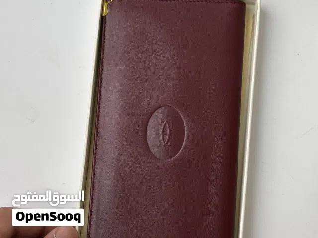 محفظة كارتير مُخزنه كالجديد .