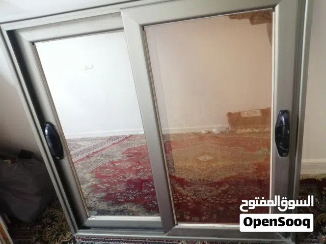 شباك المنيوم  والثاني Pvc قياس متر في متر سلايت