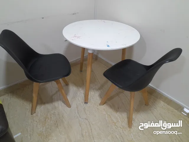Round table with two chairs for 15 OMR