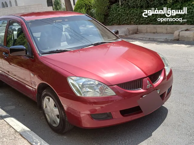 لانسر بحالة الوكاله فحص كامل بحاله ممتازه وارد وصيانه الشركه اقتصاديه جدا ليسة بحاجه صيانه كامله