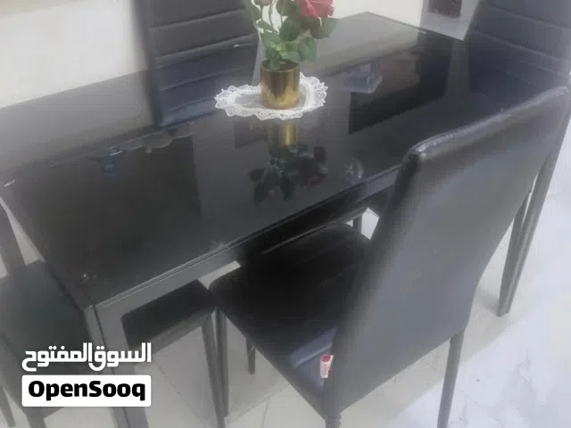 urgent sale new dining table with 4 chairs