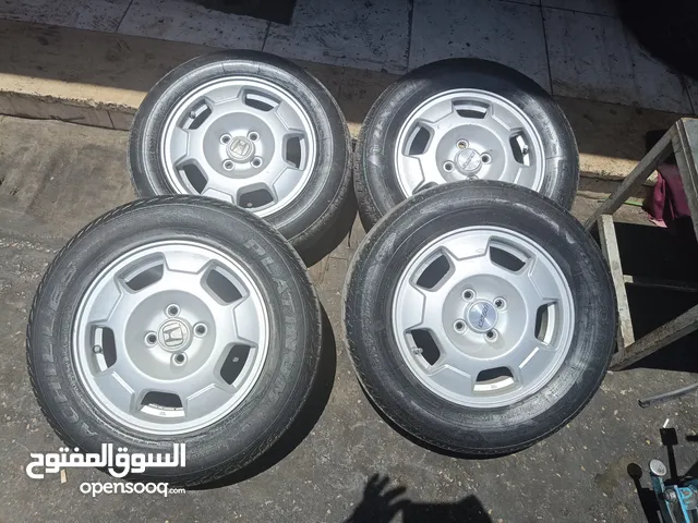 جنط هوندا اصلي 14 انش مع كوشوك بحالة جيدة