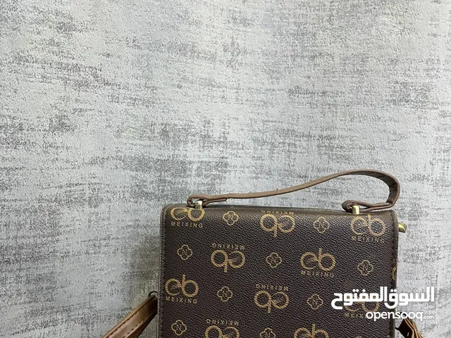 حقيبه كتف و يد لون بني فاتح و غامق
