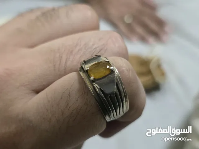 silver ring with yellow sapphire stone