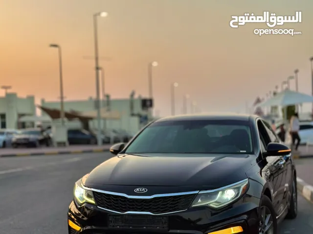 The 2019 Kia Optima LX is a midsize four-door sedan that combines comfort,  reliability, and modern