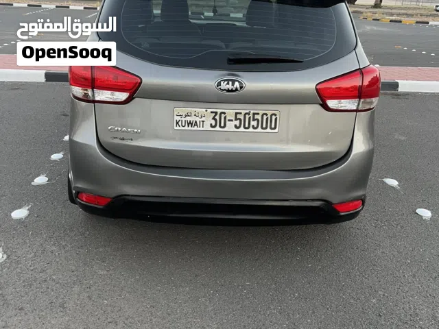 2015 كيا كارينز Standard