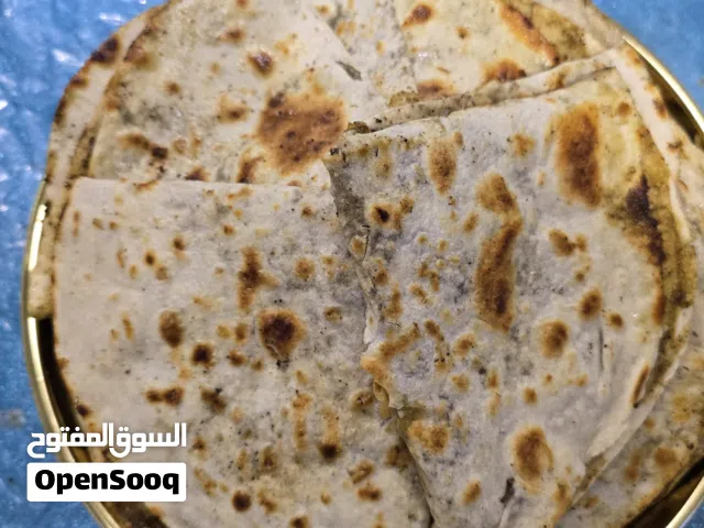 خبز صاج مهياوة بالزبدة او زيت زيتون او دهن عداني مهياوة اجار ثوم يبل مع طماط او بدون طماط كيلو 25حبة