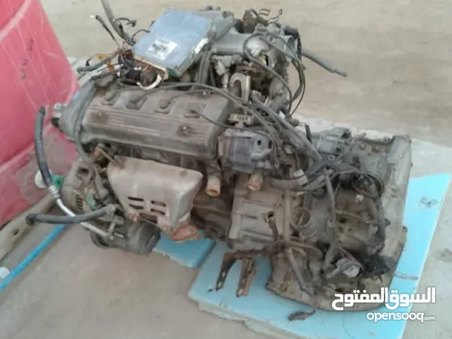 محرك وكير تيوتا كورلا مال تسعينات 4 سلندر a4 حاويه جديد كامل مع جميع تفرعاته اتوماتيك مع عقل وضفيره