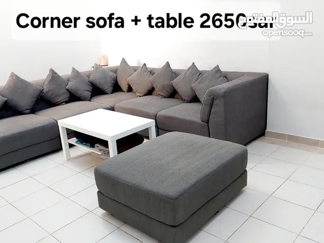 Corner sofa with centre table
