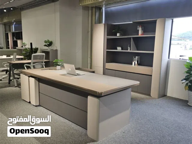 Modern L-shaped executive office desk.