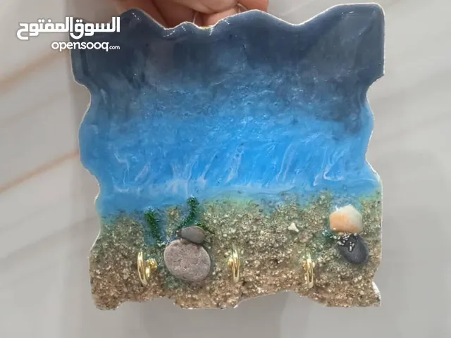 لوحات وساعات جدار فنية بالرخام والمواد الفخمة من صنع اليد