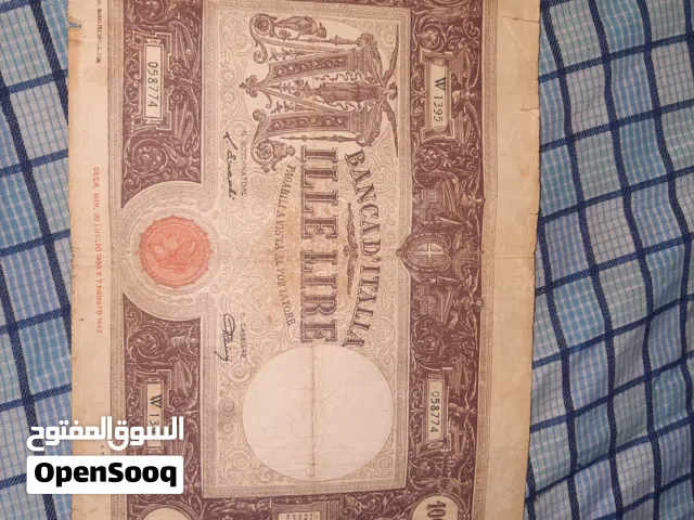 هذه الورقة النقدية هي 1000 ليرة إيطالية من فئة "باربيتي" (Barbetti).