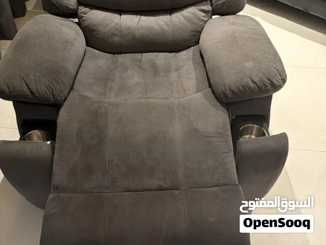 Grey recliner chair very comfortable and has two cup holders