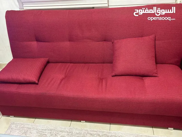 Sofa beds with storage ruby red color and 2 poufs