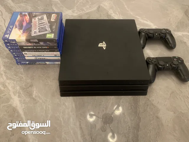 PlayStation 4 Pro with 2 controller and 9 games