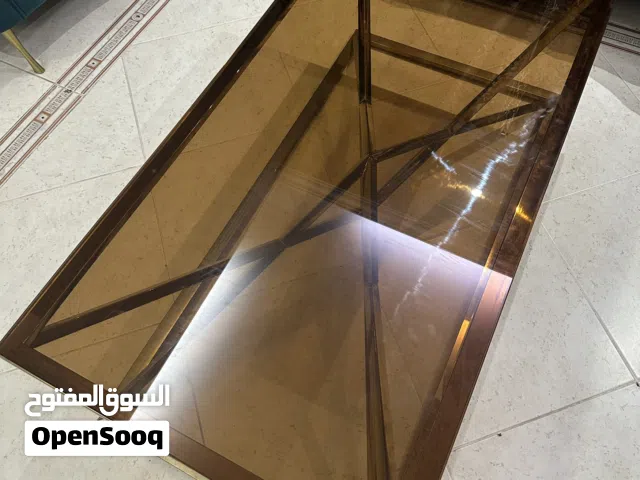 Bronze-Tinted Glass Coffee Table with Golden Frame – Elegant Design