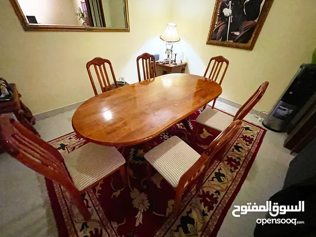 Wooden dining table and six chairs