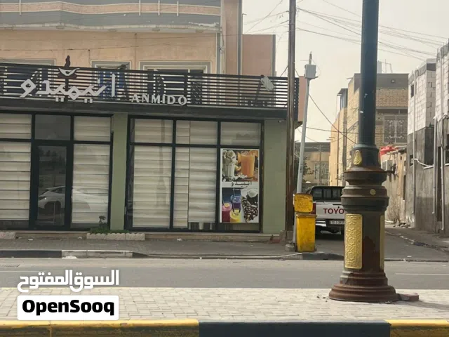 بيت مع محلات تجارية للبيع في البصرة المساحة 240 م