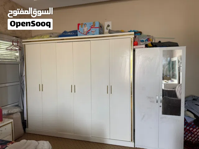 Bedroom set including 2 cupboards, 2 side tables, 1 dressing, 1 super king size bed and a sofa.
