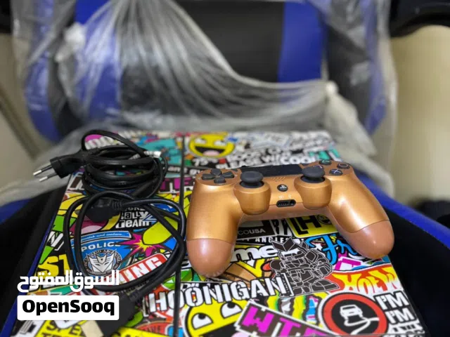 PS4 with controller and wires بلايستيشن4