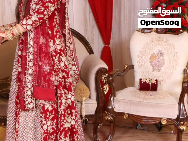 Wedding gown With tail and potli