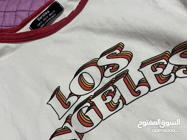 A cute white Los Angeles shirt from bershka size S. بلوزة جميلة من بيرشكا حجم سمول