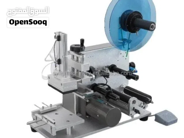 آلة وضع ملصقات على العبوات المسطحه و المربعه و المستطيله (شوف الوصف)
