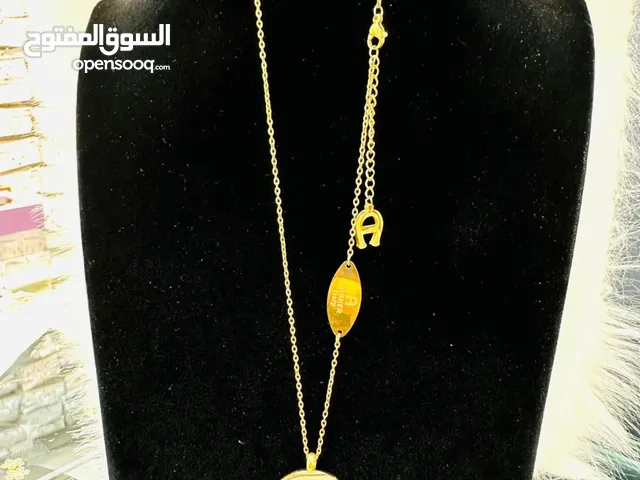 قلادة ماركة اقنر مطلي ذهب