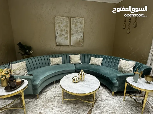 Beautiful curved 6 seater sofa and 3 piece marble /gold coffee tables