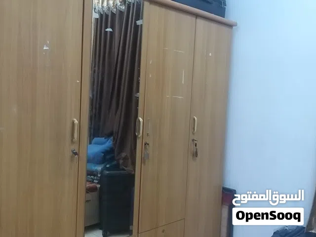 4 Doors wooden cupboard with a mirror and 5 drawers