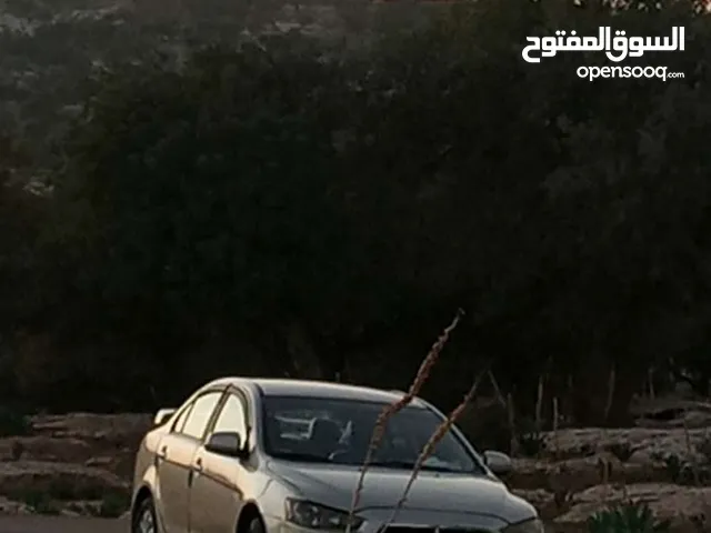 سيارة ميتسوبيشي لانسر 2014/EX للبيع /اعلى صنف(GLS) من المالك مباشرة