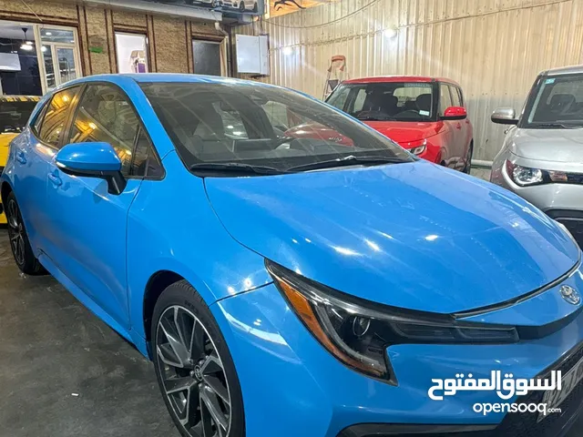 a blue Toyota Corolla Hatchback likely 2022 model Hatchback تيوتا كوريلا هاتشباك