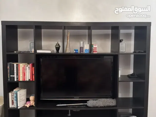 Italian TV showcase with tea table