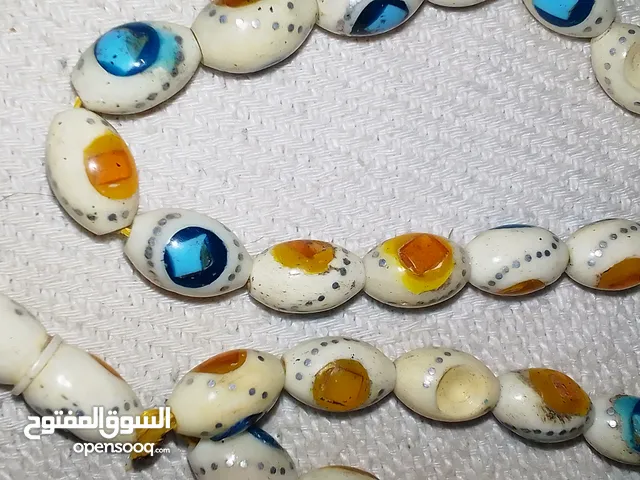 مسبحه عضم عاج مطعم فضه والحجار ثانيه ما بعرف فيروزي وكهرب او شي ثاني