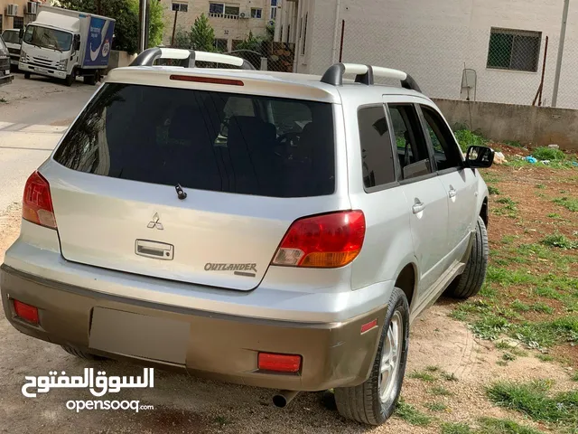 متسوبشي اوت لاندر موديل 2003 لون فيراني جنط المنيوم فحص السياره اربع جيد الحاله جيد جدا مرخصه لشهر 1