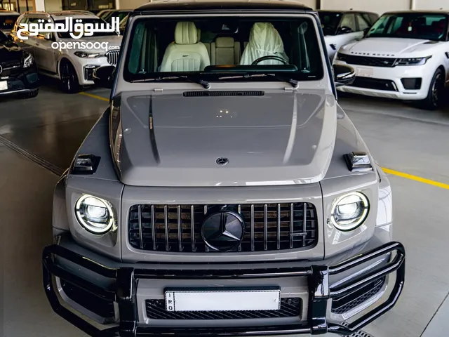 Mercedes G63 AMG Manufaktur 2021 ماشية 29 الف كيلو كاملة المواصفات 1/1 لونها اسمنتي وقماره سوده