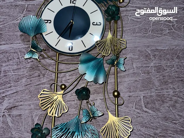 ساعه حائط طاوس