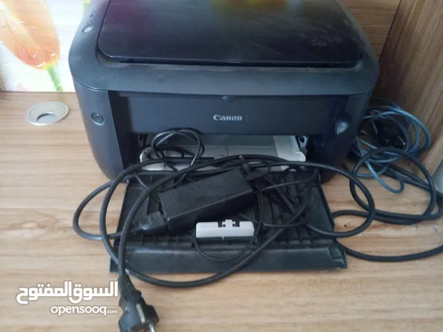 طابعه كانون مع إسلاكها الاصليه والكوابل نظيفه جدا ناقصها حبر