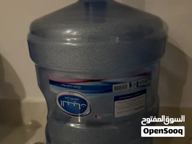 2 empty Al Bayan 5-gallon water gallons