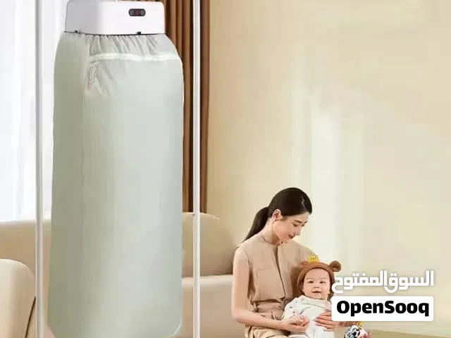 آلة تجفيف وكي الملابس