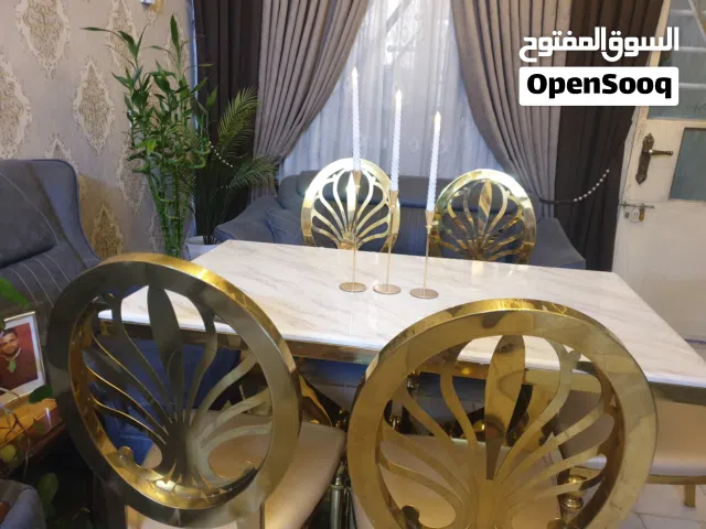 ميز طعام مرمر كراسي ستيل