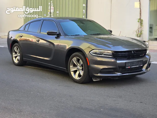 دودج شارجر موديل 2019 لون رمادي 6 سلندر بحالة ممتازة اوراق جمارك