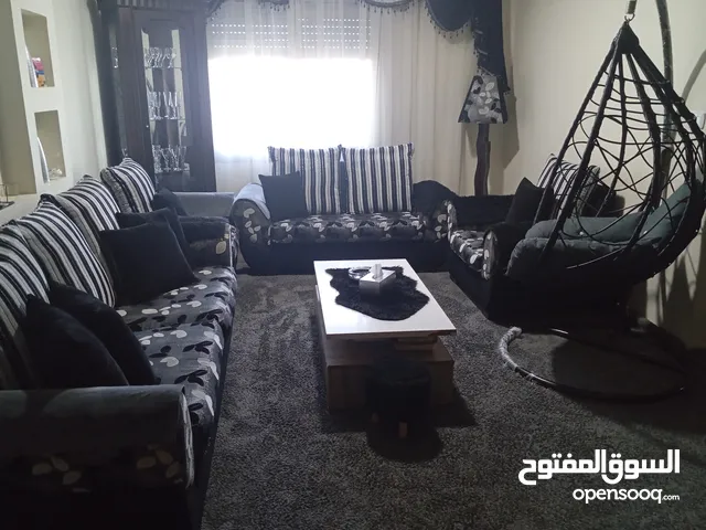 طقم كنب لون سكني واسود