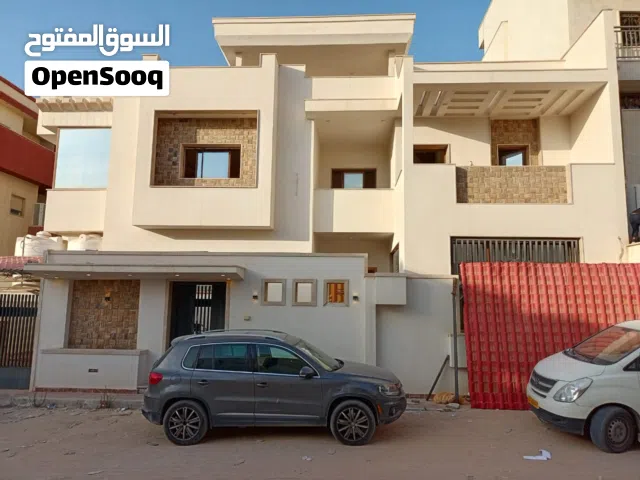 مبنى تجاري وسكني للبيع 3 صالات مع فيلا 3 ادوار خلف جامعة طرابلس