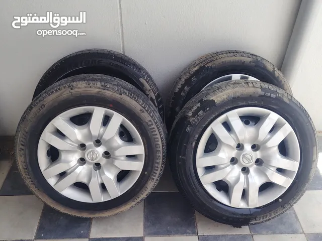 4رنجات مع 4طاسات نيسان التيما وكاله