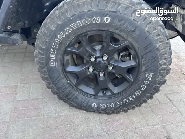 5 rims and tires of jeep wrangler