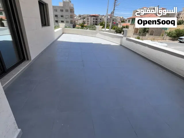 شقة ارضية مع ترس 70متر بتشطيب مميز في مرج الحمام قرب مدارس الراهبات