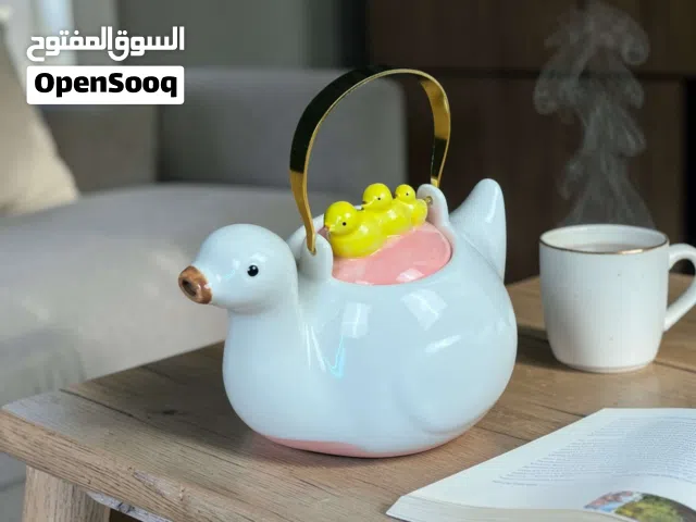قوري شاي بتصميم البطات الثلاث