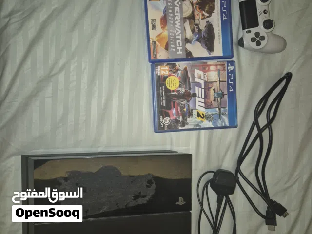 ps4 with white controller and 3 games